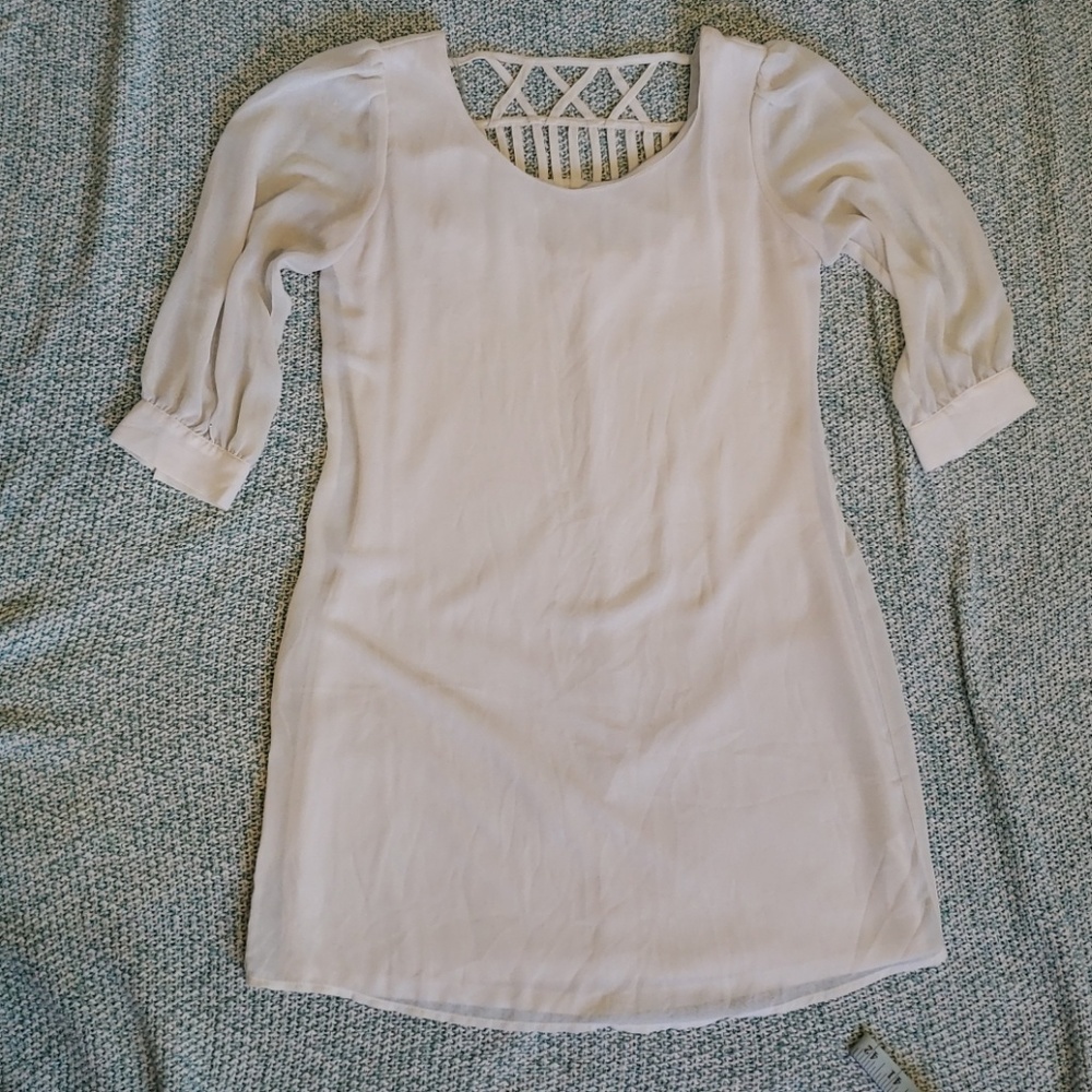 White dress with decorative back